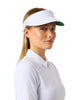 A woman in a white polo shirt wearing a white visor with a green brim, photographed against a white studio background.