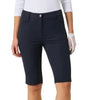 A model wearing dark navy golf capri pants with a white long-sleeve top and a white golf glove, shown from the waist down against a light gray background.