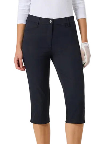 Person wearing navy capri pants on a white background