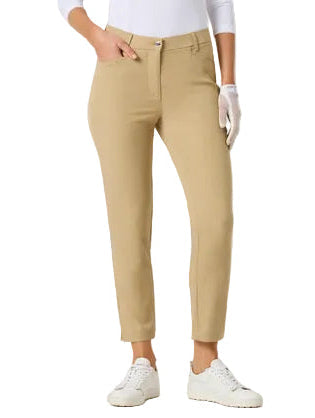 A woman modeling a white long-sleeve polo shirt and beige cropped trousers, standing against a light gray studio background.