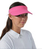Woman wearing a pink visor against a white background