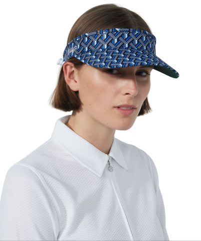 Woman wearing a blue patterned visor against a white background