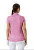 Woman wearing a pink patterned polo shirt on a white background