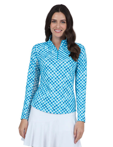 Woman wearing a blue and white checkered long-sleeve top and white skirt on a white background