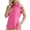 Woman wearing a pink and colorful patterned outfit on a white background