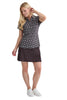 Woman wearing a patterned shirt and black skirt on awhite background