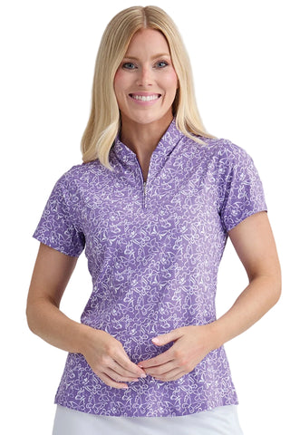 Woman wearing a purple floral patterned shirt on a white background