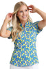 Woman wearing a blue and yellow patterned blouse against a plain background