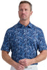 Man wearing a blue patterned shirt against a light gray background