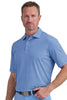 Man wearing a blue patterned shirt against a light gray background