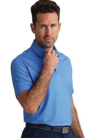Man wearing a blue patterned polo shirt against a white background
