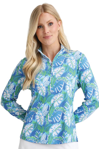 Woman wearing a blue floral patterned shirt against a white background