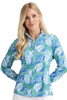 Woman wearing a blue floral patterned shirt against a white background