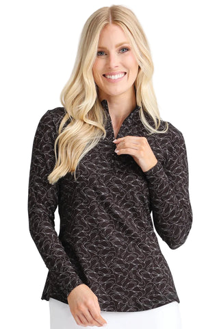 Woman wearing a black patterned long-sleeve shirt on a white background