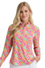 Woman wearing a colorful patterned shirt with a plain background