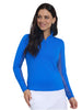 Woman wearing a blue long-sleeve top and white skirt on a white background
