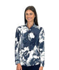 Woman wearing a floral patterned blouse with a white background
