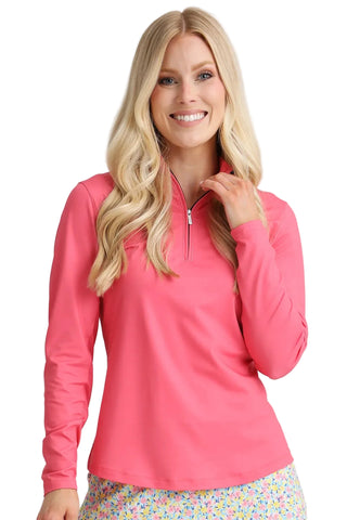 Woman wearing a pink long-sleeve top with a zipper on a gray background