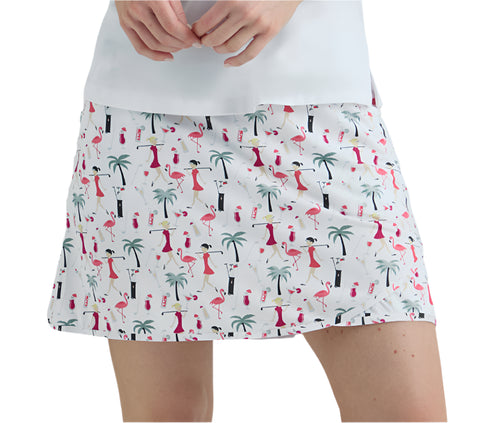 Skirt with flamingo and palm tree pattern worn by a person on a white background