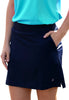 Person wearing a blue top and navy skirt with a white background