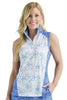 Woman wearing a sleeveless floral top with a blue and white pattern on a plain background