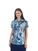 Woman wearing a patterned blue and white shirt on a white background