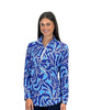 Woman wearing a blue leaf-patterned pullover on a white background