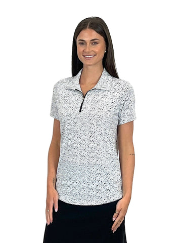 Woman wearing a white polo shirt with black pattern on a white background