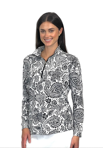 Woman wearing a black and white patterned long-sleeve shirt on a white background