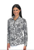 Woman wearing a black and white patterned long-sleeve shirt on a white background