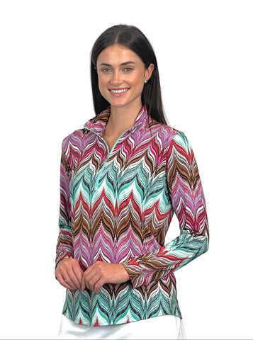Woman wearing a colorful patterned shirt on a white background