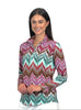 Woman wearing a colorful patterned shirt on a white background