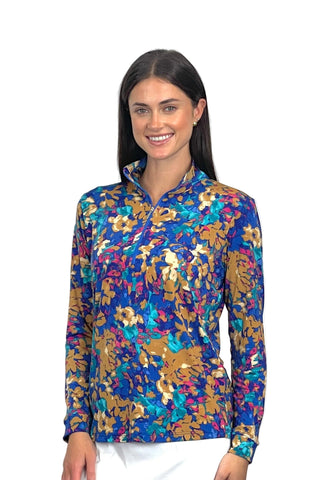 Woman wearing a colorful floral patterned shirt on a white background