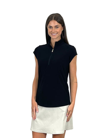 Woman wearing a black sleeveless top and white skirt on a white background