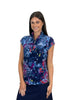 Woman wearing a colorful floral patterned sleeveless top on a white background