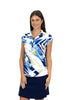 Woman wearing a colorful patterned shirt and navy skirt on a white background