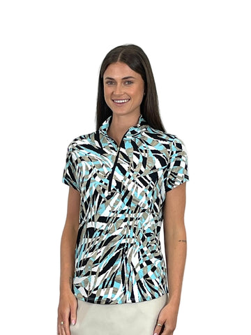 Woman wearing a patterned short-sleeve shirt against a white background