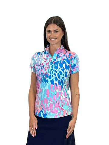 Woman wearing a colorful patterned shirt on a white background