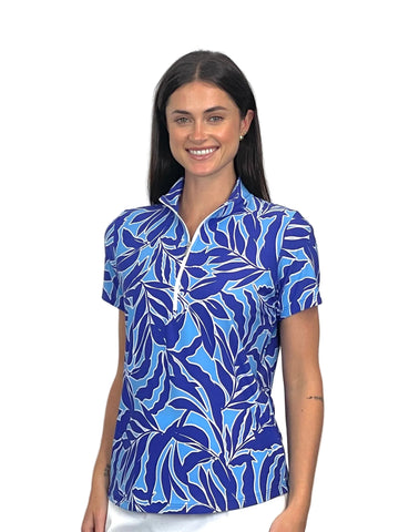 Woman wearing a blue leaf-patterned shirt on a white background