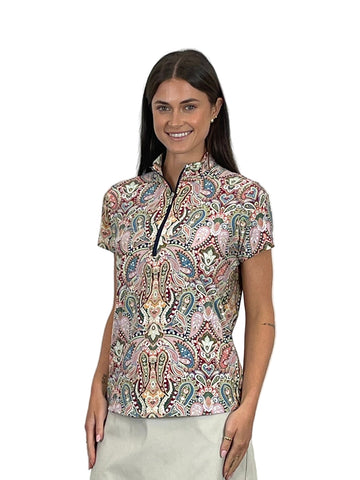 Woman wearing a patterned blouse against a white background