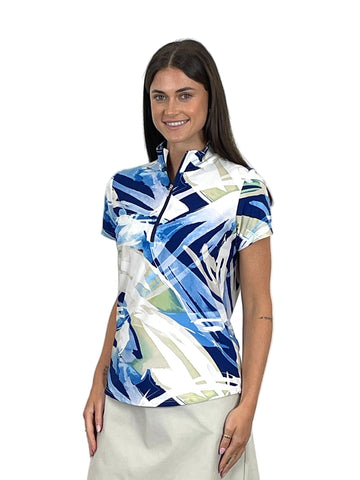 Woman wearing a colorful patterned shirt against a white background