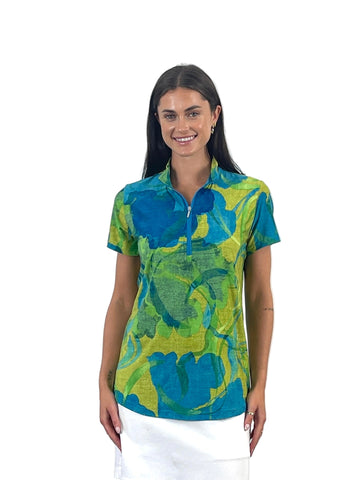 Woman wearing a colorful patterned shirt on a white background