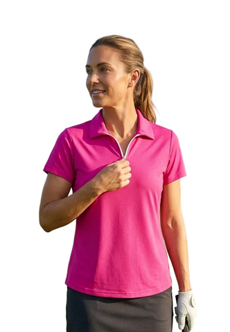 Woman in a pink polo shirt on a golf course