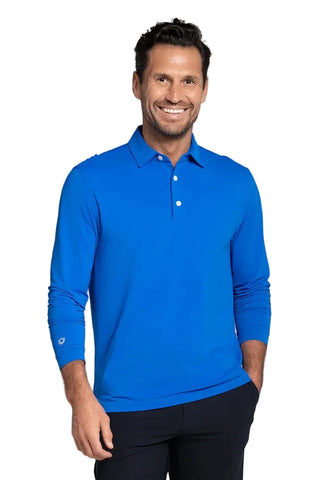 A smiling man wearing a bright blue long-sleeve polo shirt 