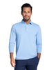 A man wearing a light blue long-sleeve polo shirt 