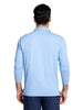A man viewed from the back wearing a light blue long-sleeve polo shirt 
