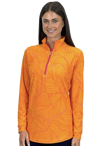 Woman wearing an orange patterned shirt with a white background