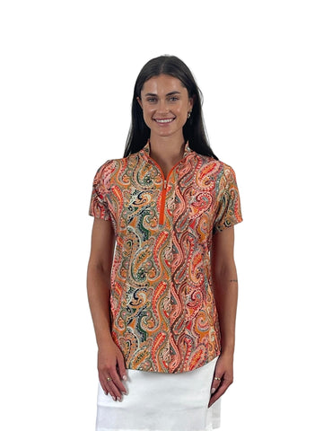 Woman wearing a patterned shirt against a white background
