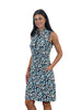 Woman wearing a sleeveless patterned dress on a white background