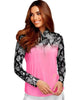 Woman wearing a pink and black patterned top on a white background